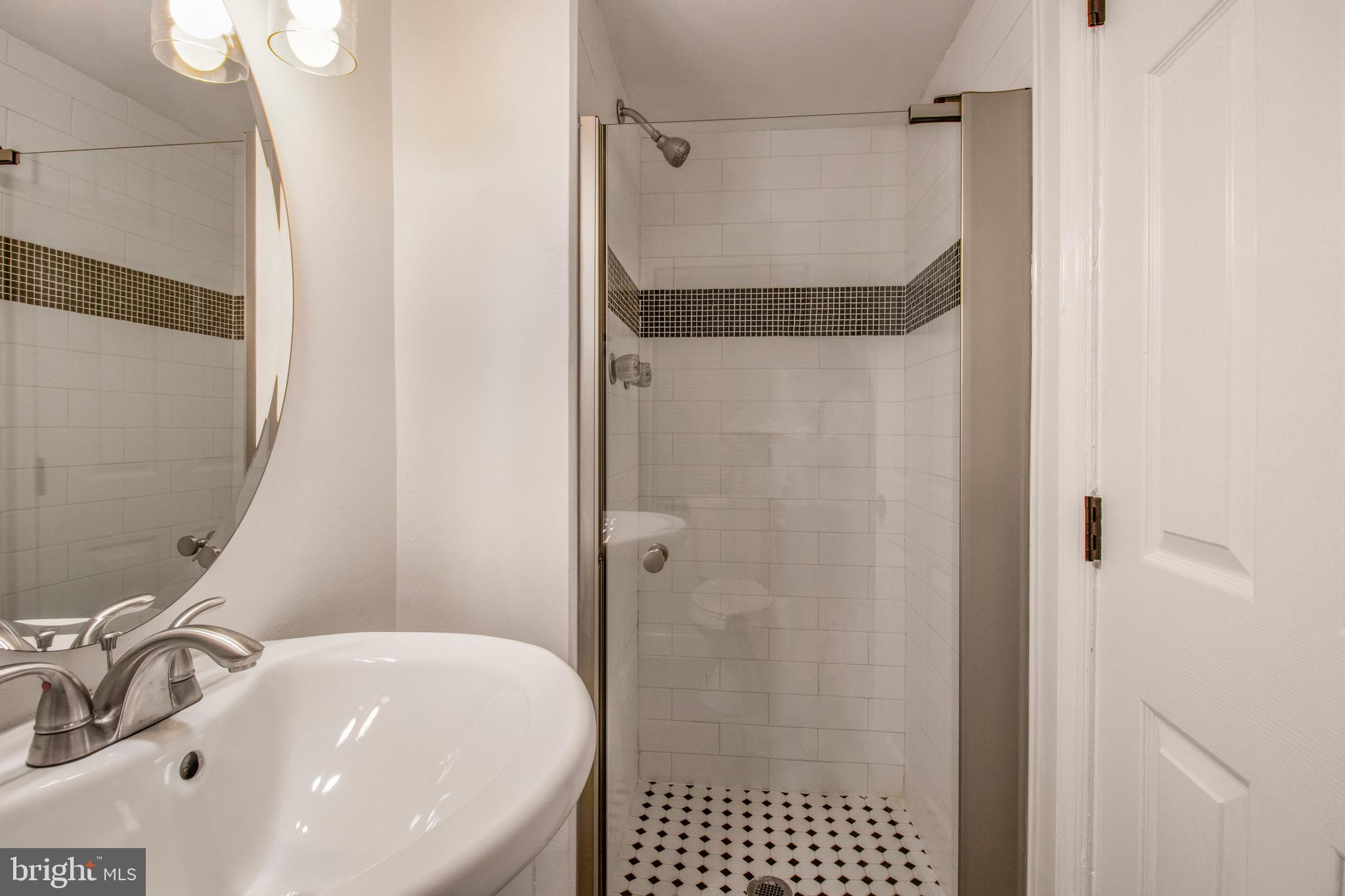 104 15th Street Southeast, Unit B Washington, DC 20003 - Photo 18 of 18 a bathroom with a sink and a shower