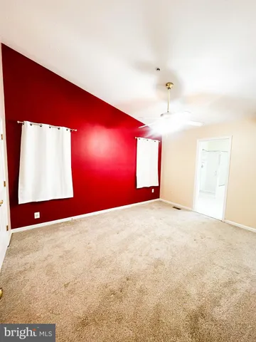 a bathroom with a bathtub sink and mirror