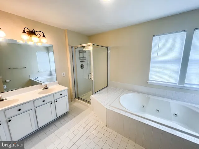 an empty room with a empty space and windows