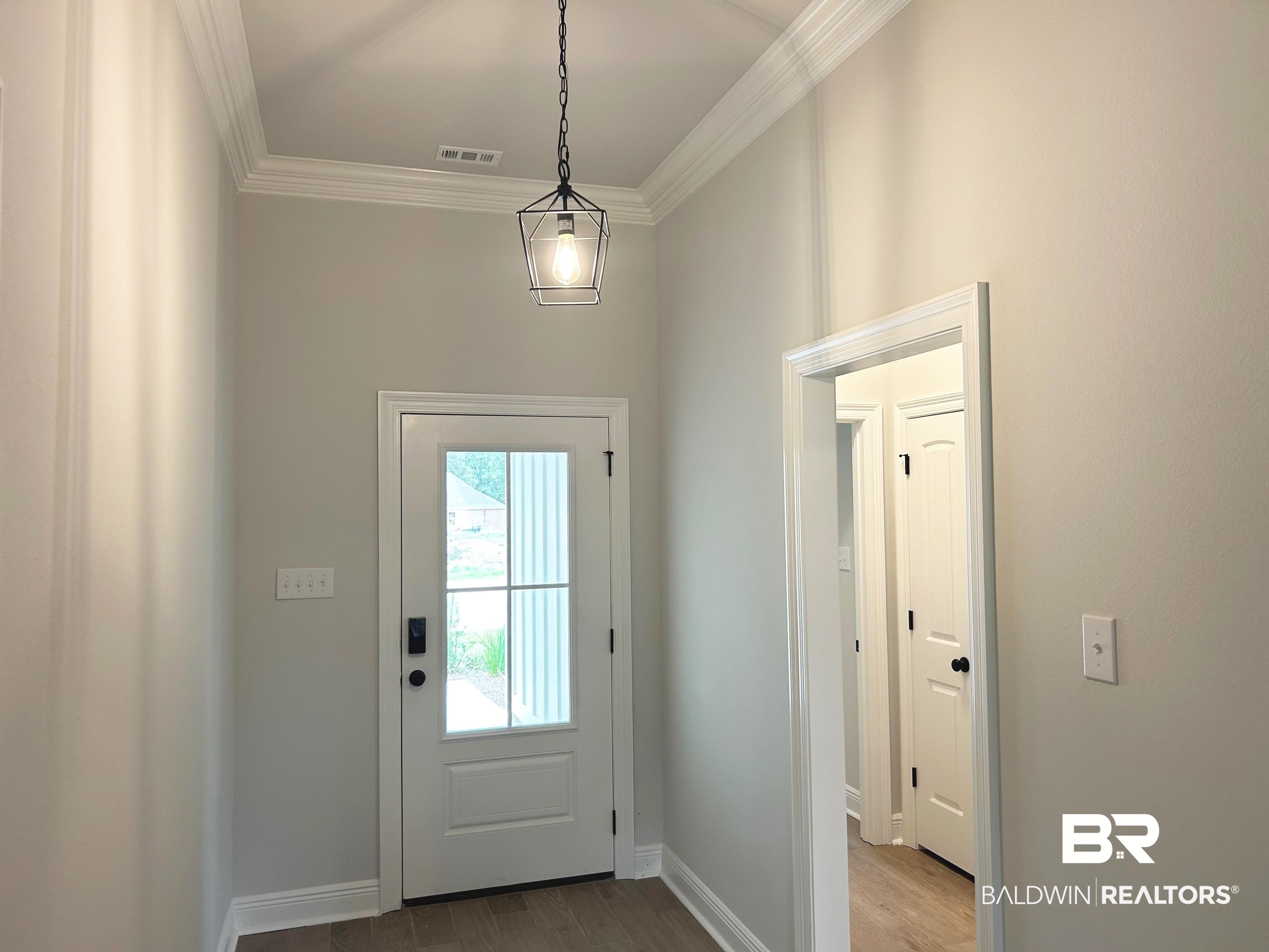 860 Sumter Loop Foley, AL 36535 - Photo 2 of 26 Doorway featuring hardwood / wood-style floors and ornamental molding