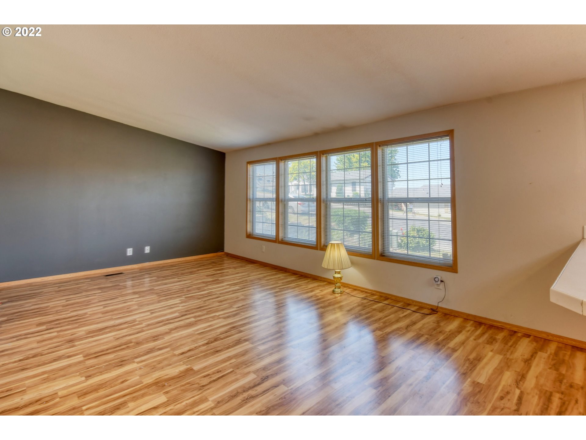 3021 Southwest River View Drive Pendleton, OR 97801 - Photo 8 of 32 a view of an empty room with wooden floor and a window