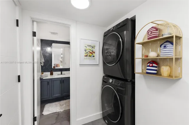 a view of a storage and utility room with washer and dryer
