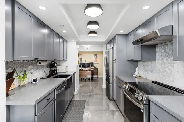 a kitchen with a stove and a sink