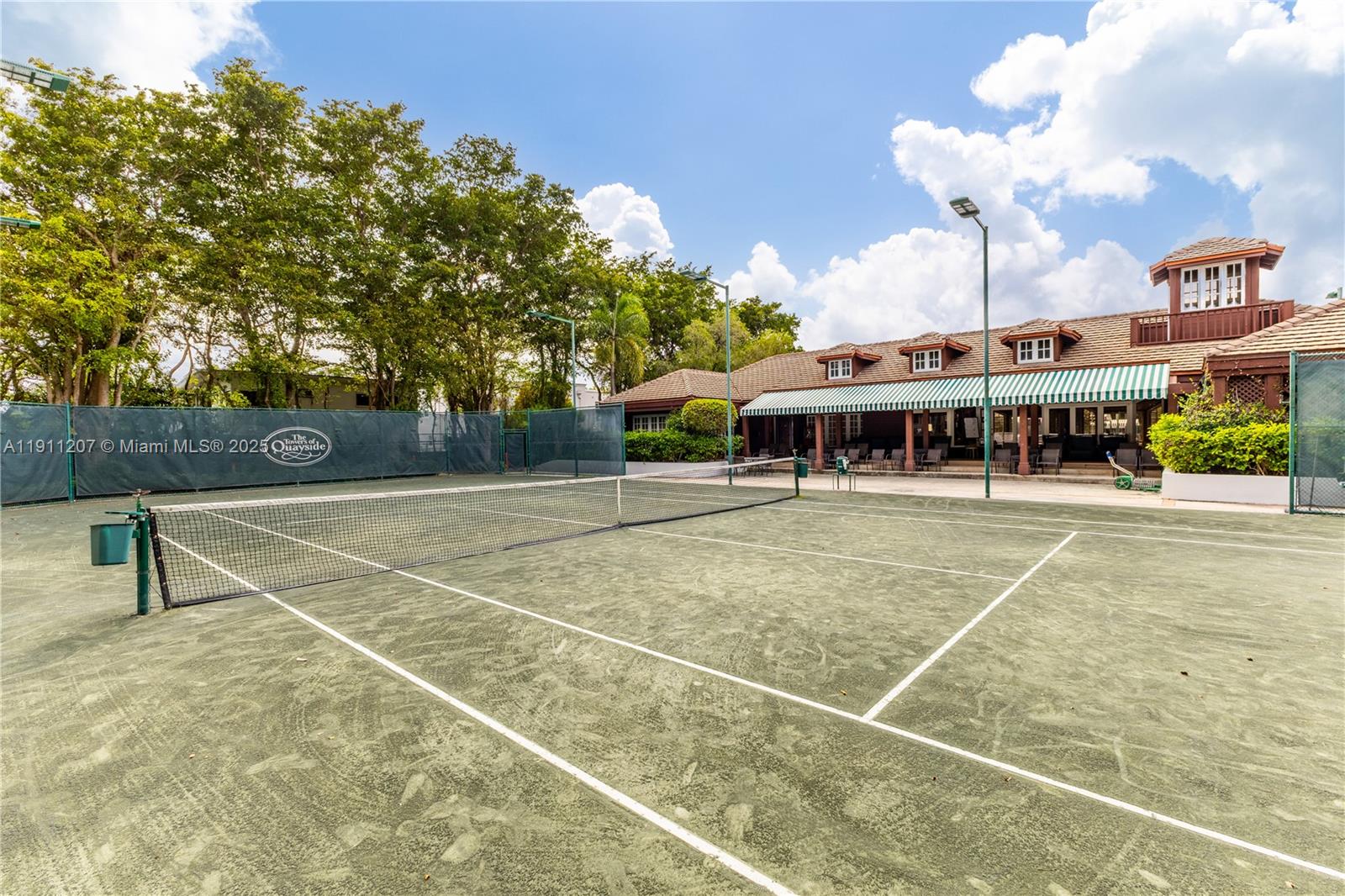 1000 Quayside Terrace, Unit 506 Miami, FL 33138 - Photo 34 of 42 a view of a tennis ground with large trees