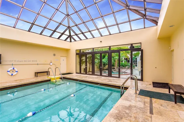 a spacious bathroom with a sink mirror and window