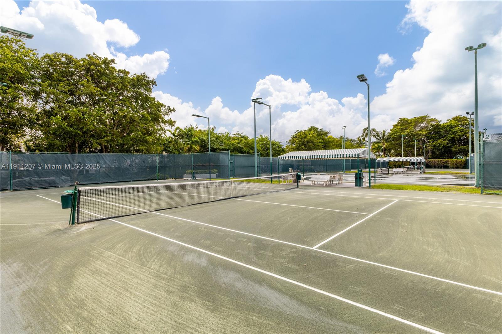 1000 Quayside Terrace, Unit 506 Miami, FL 33138 - Photo 36 of 42 a view of a tennis court with table and chairs
