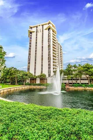 a view of a large building with a big yard