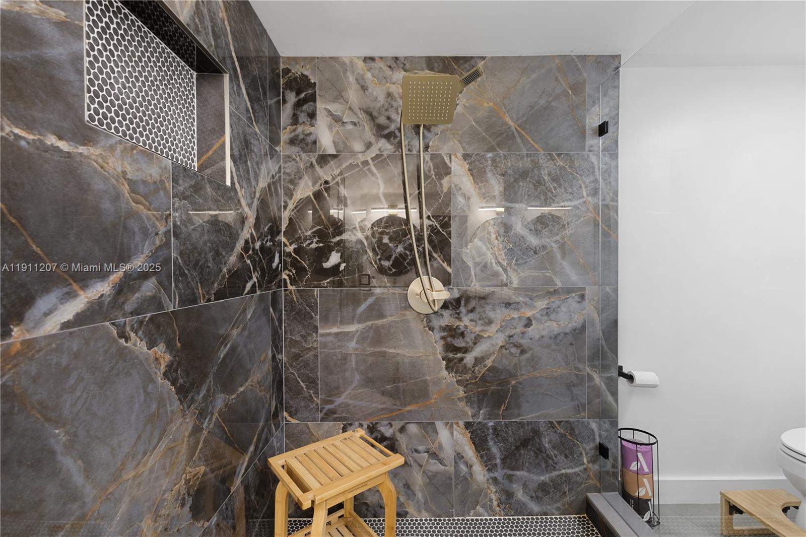 1000 Quayside Terrace, Unit 506 Miami, FL 33138 - Photo 10 of 42 a bathroom with a toilet and shower