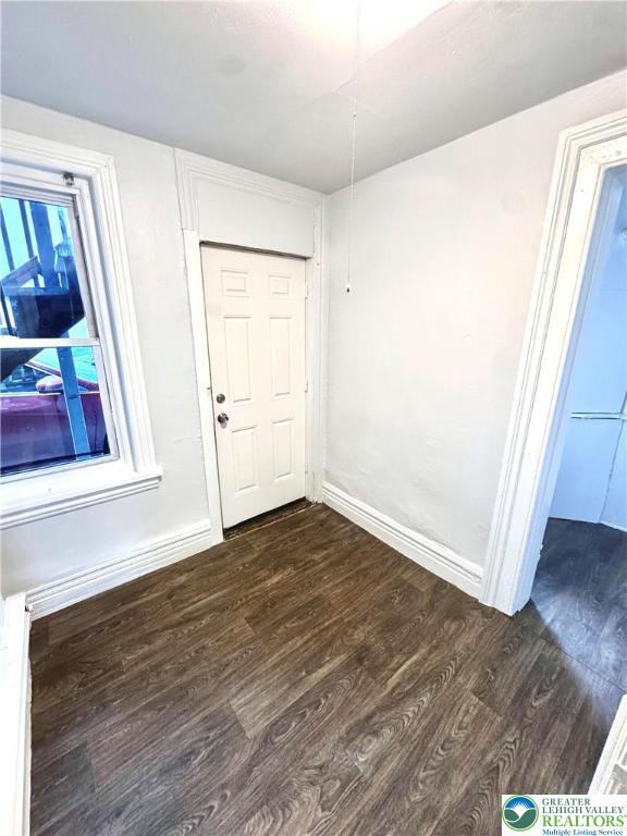 122 North 8th Street, Unit AAA Allentown, PA 18101 - Photo 3 of 9 an empty room with wooden floor and window