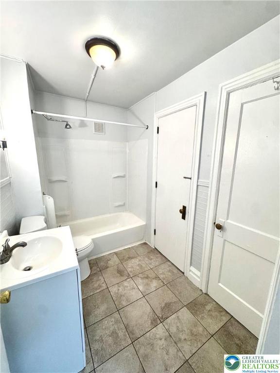 122 North 8th Street, Unit AAA Allentown, PA 18101 - Photo 8 of 9 a bathroom with a sink a toilet and shower