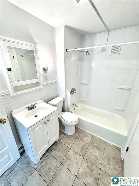 122 North 8th Street, Unit AAA Allentown, PA 18101 - Photo 9 of 9 a bathroom with a sink vanity mirror and toilet
