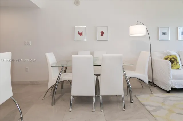 a utility room with multiple dryer and washer