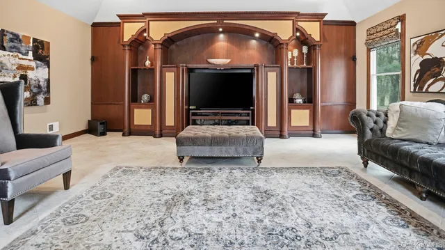 a living room with a couch and a flat screen tv