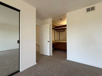 a view of an empty room with a balcony