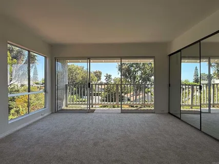 a bathroom with a granite countertop toilet a sink and bathtub