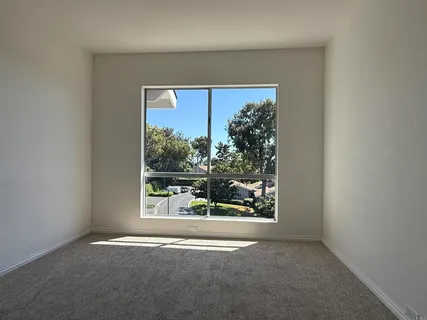 a view of a room with a large window