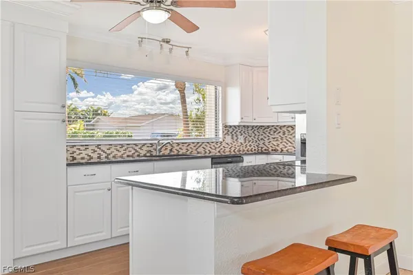 a kitchen with a sink and a window