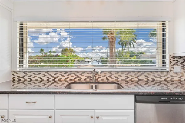 a view of a sink and a window
