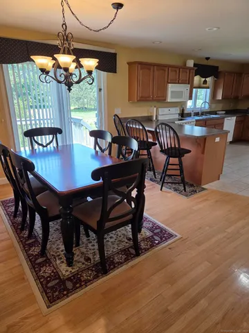 a living room with furniture a window and a table
