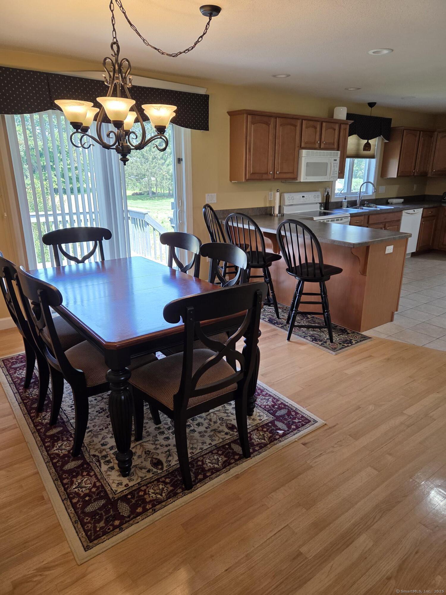a living room with furniture a window and a table