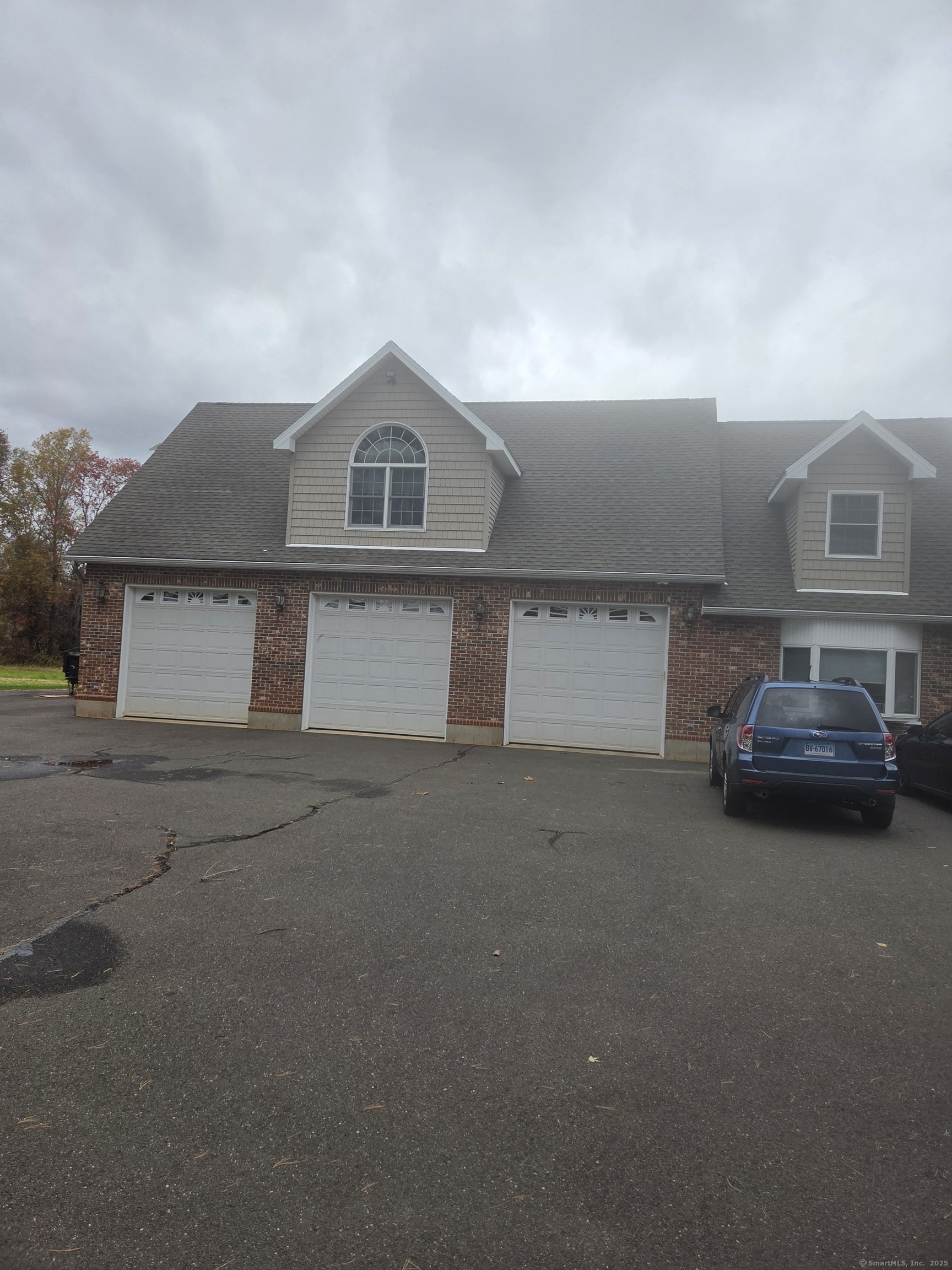 216 Wells Road East Windsor, CT 06088 - Photo 2 of 12 a front view of a house with parking space