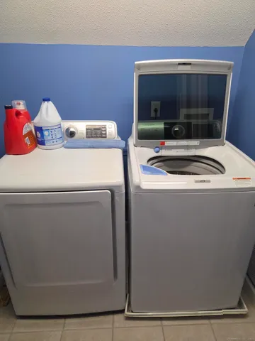 a utility room with washer and dryer