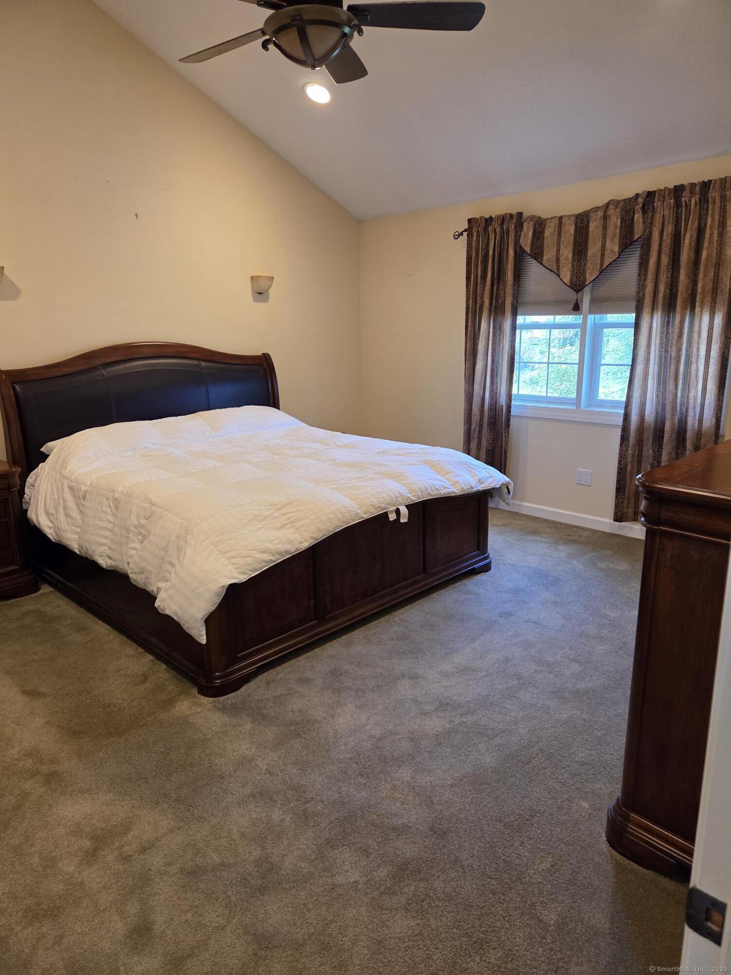 216 Wells Road East Windsor, CT 06088 - Photo 7 of 12 a bed sitting in a bedroom next to a window