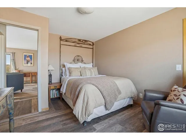a living room filled with furniture and a floor to ceiling fan