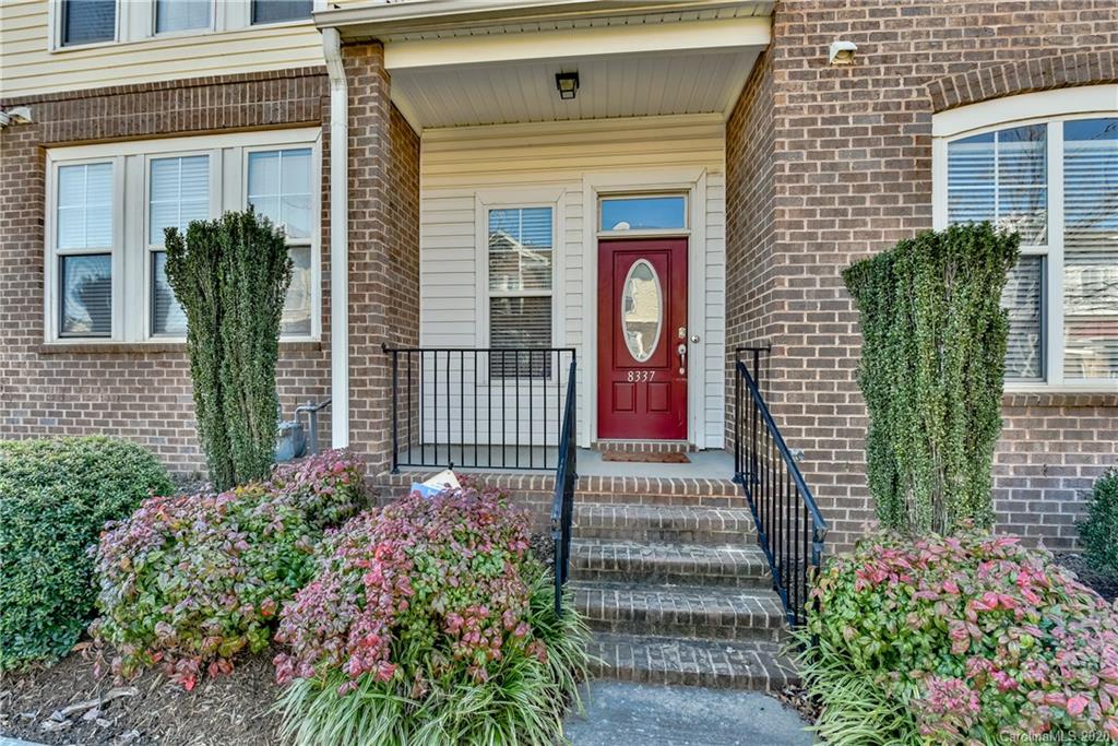 8337 Scotney Bluff Avenue Charlotte, NC 28273 - Photo 2 of 31 a front view of a house with a garden