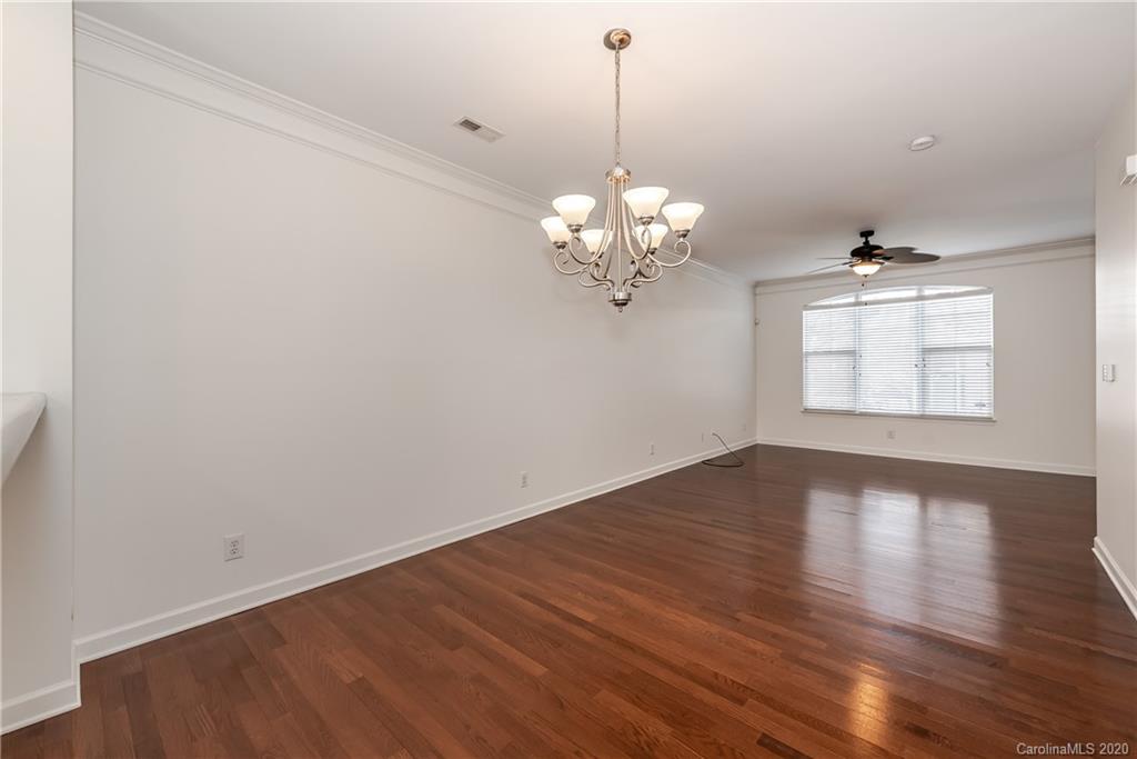 8337 Scotney Bluff Avenue Charlotte, NC 28273 - Photo 11 of 31 a view of a room with wooden floor chandelier and entryway
