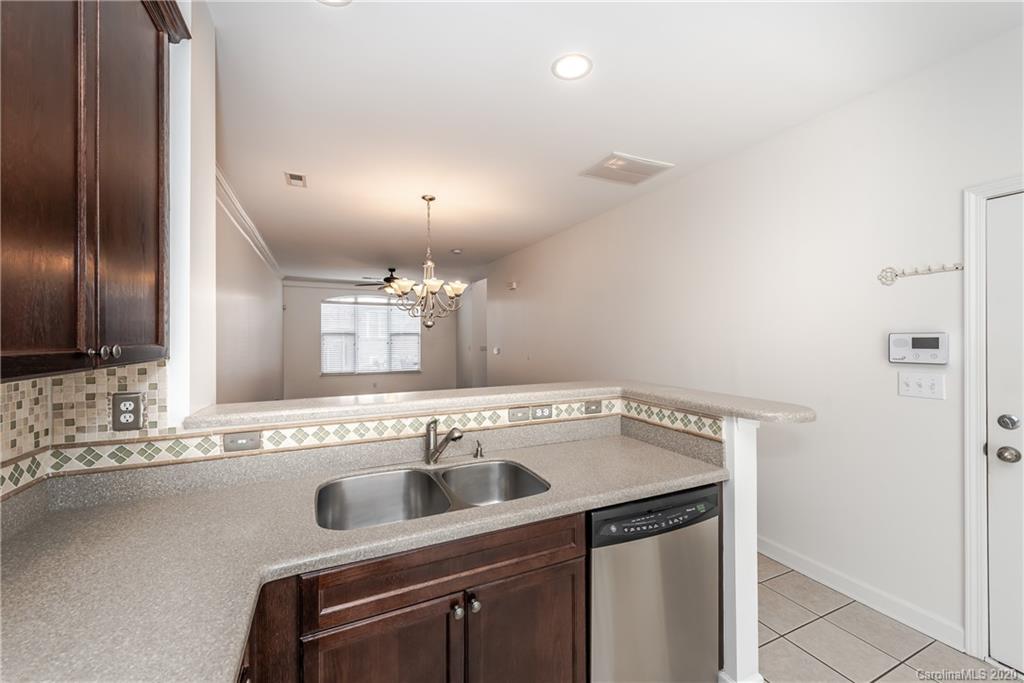 8337 Scotney Bluff Avenue Charlotte, NC 28273 - Photo 17 of 31 a view of a sink a refrigerator and a sink