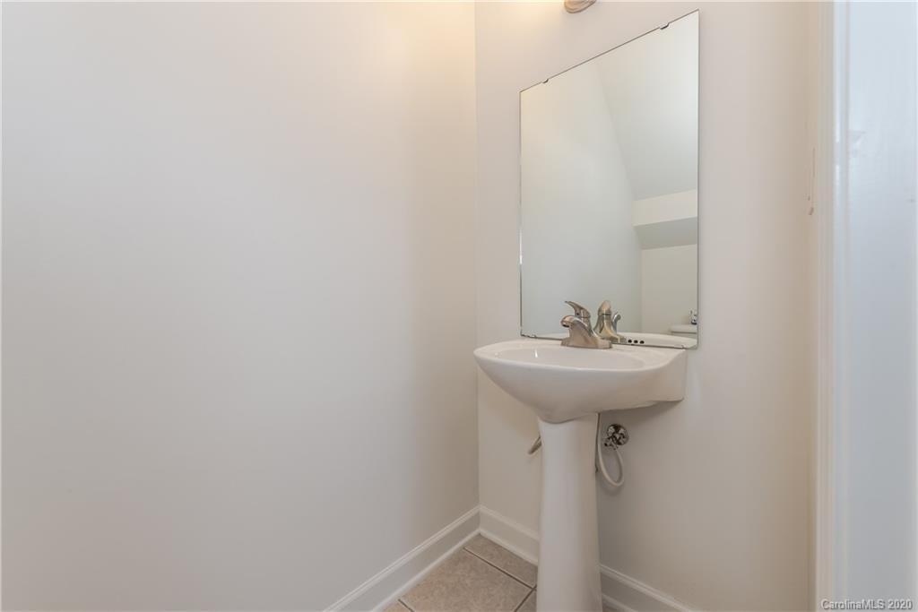 8337 Scotney Bluff Avenue Charlotte, NC 28273 - Photo 19 of 31 a bathroom with a sink and a mirror