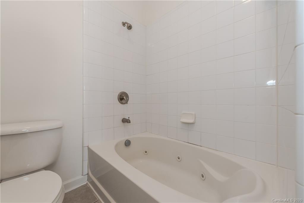 8337 Scotney Bluff Avenue Charlotte, NC 28273 - Photo 24 of 31 a bathroom with a toilet and bathtub