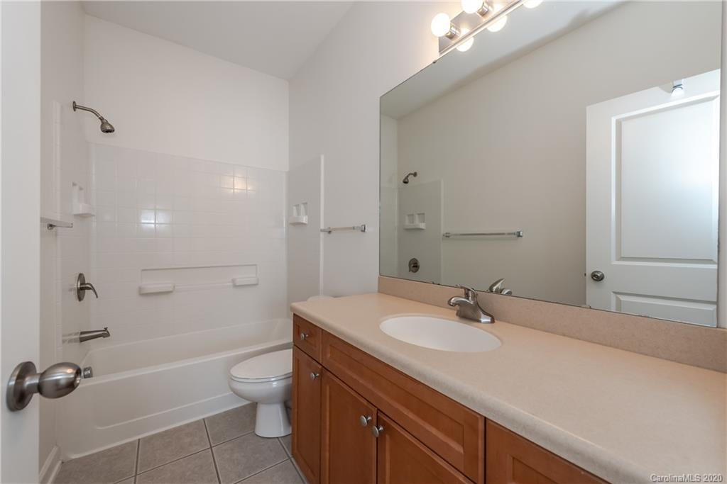 8337 Scotney Bluff Avenue Charlotte, NC 28273 - Photo 28 of 31 a bathroom with a sink a toilet and shower