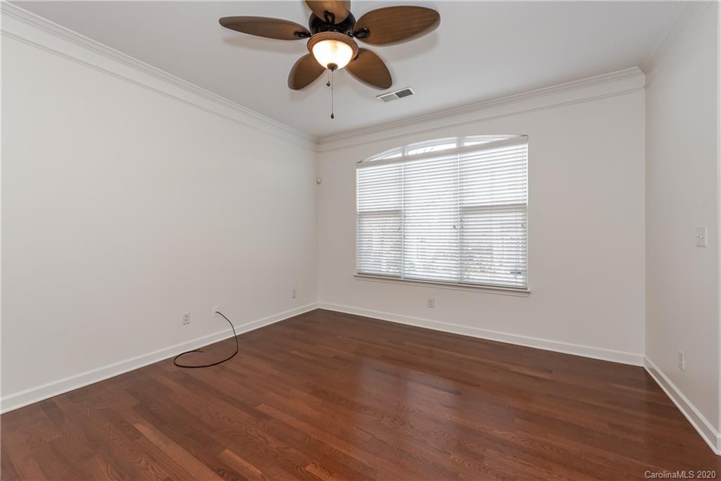8337 Scotney Bluff Avenue Charlotte, NC 28273 - Photo 5 of 31 wooden floor in an empty room with a window