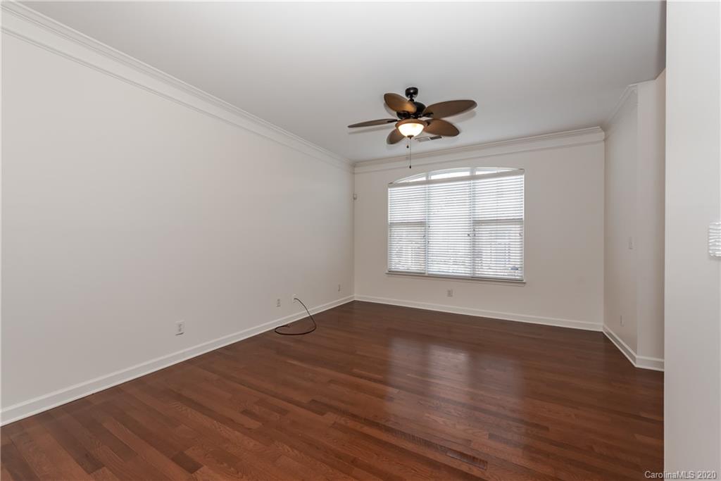 8337 Scotney Bluff Avenue Charlotte, NC 28273 - Photo 9 of 31 wooden floor in an empty room with a window