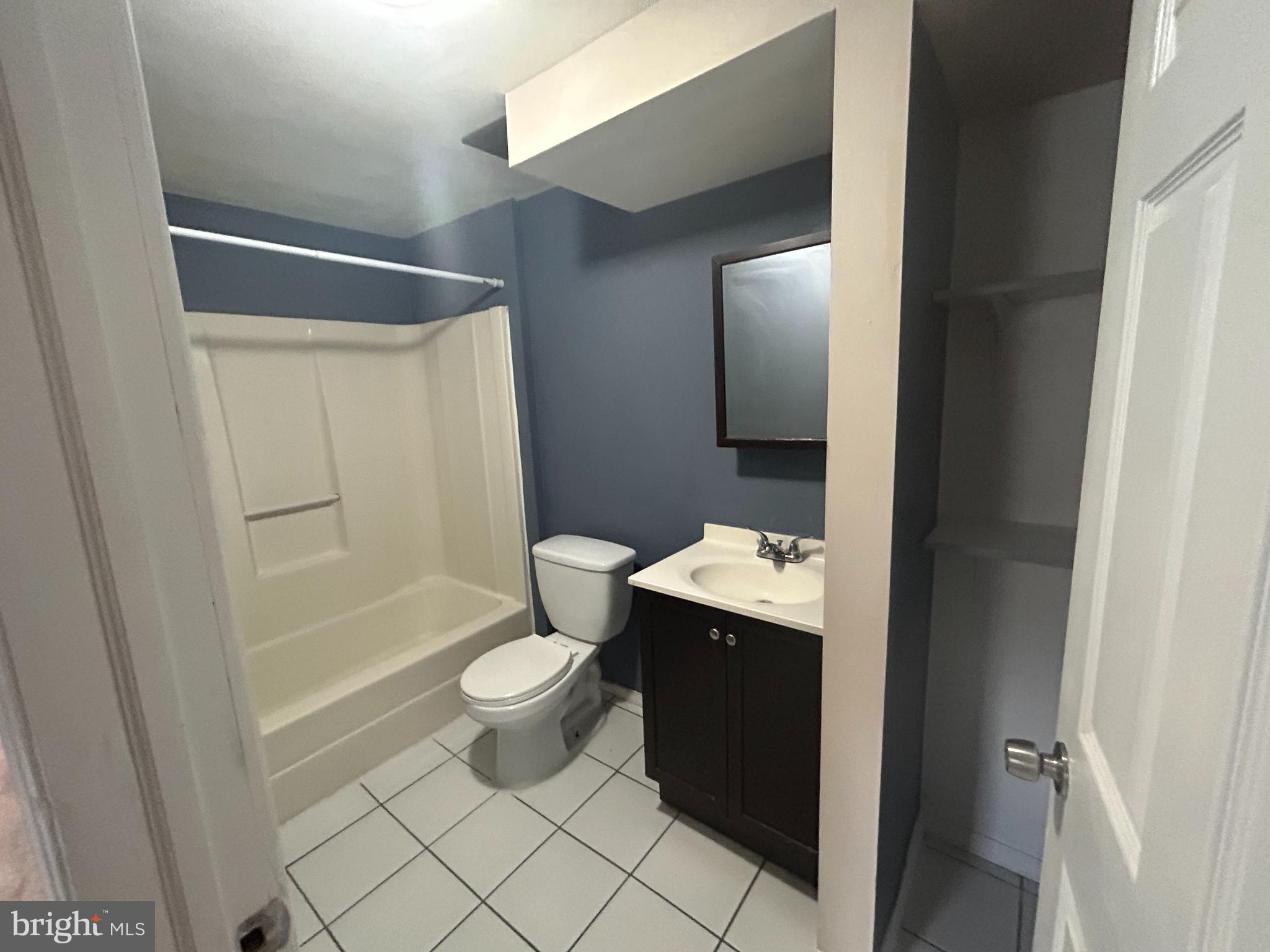 47-49 Hanover Street, Unit 49A Pemberton, NJ 08068 - Photo 12 of 12 a bathroom with a sink a toilet and shower