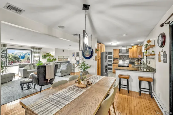 a living room with lots of furniture and a chandelier