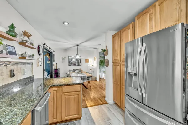 a bedroom with a bed couch and window