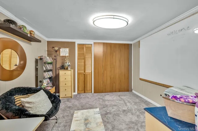 a view of a house with backyard sitting area and garden