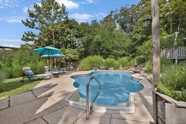 an aerial view of a house with a yard and garden