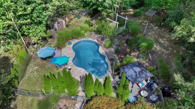 an aerial view of a houses with yard