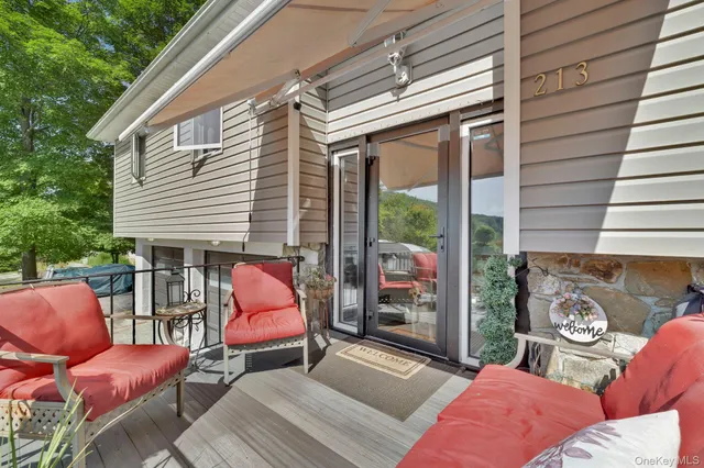 a outdoor space with patio the couches and pool table with chairs