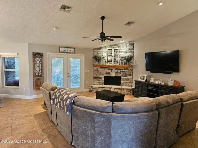a living room with furniture and a rug
