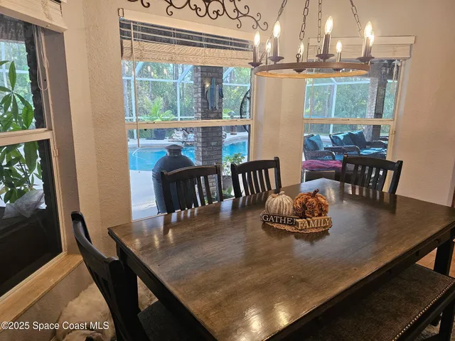 a bedroom with a bed and a flat tv screen on dresser