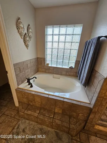 a bathroom with a double vanity sink toilet and shower