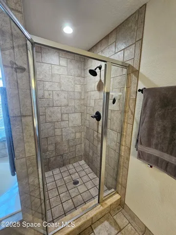 a bathroom with a bathtub and a shower