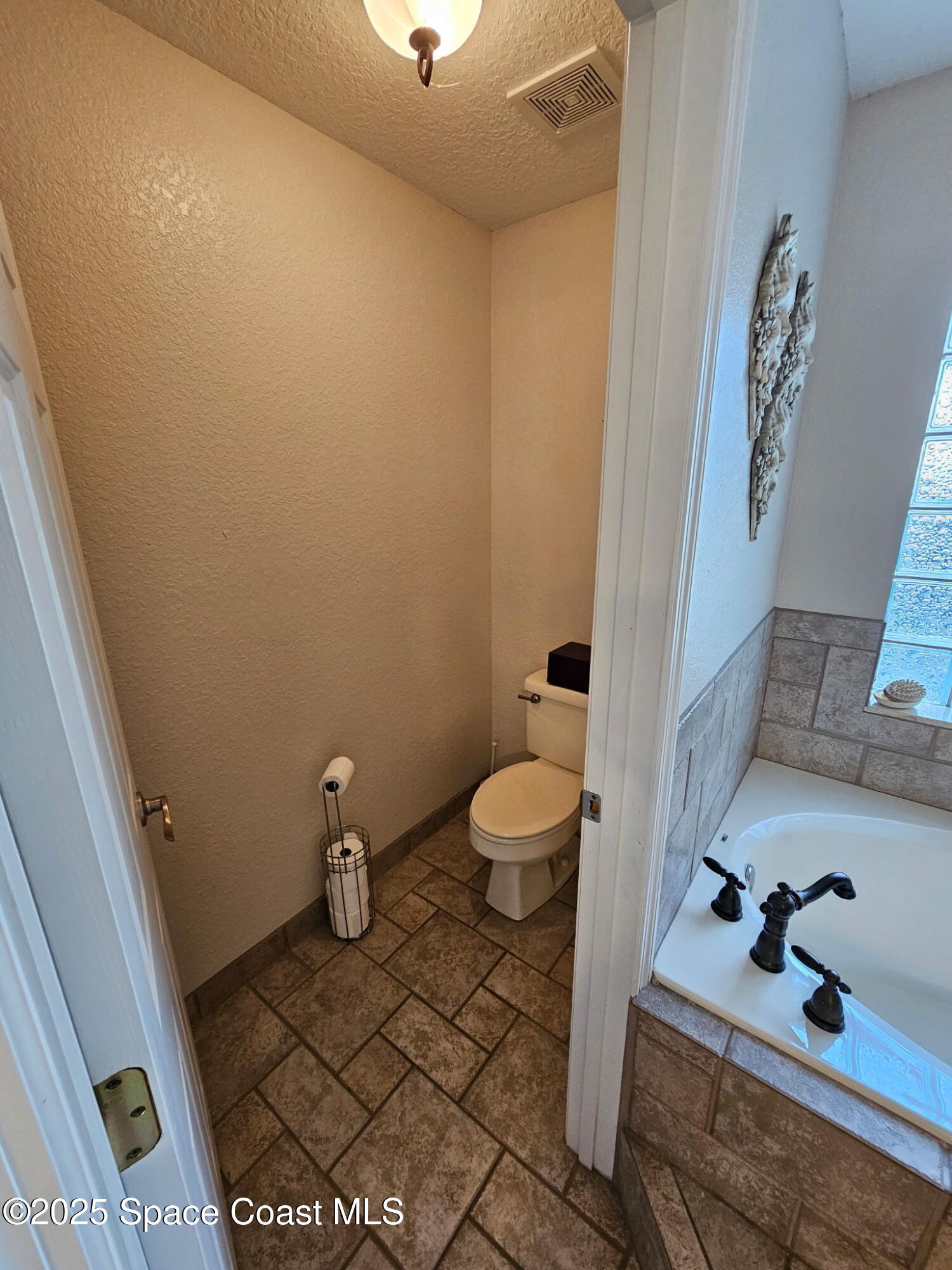 3094 Green Turtle Circle Mims, FL 32754 - Photo 34 of 63 a bathroom with a sink and a toilet