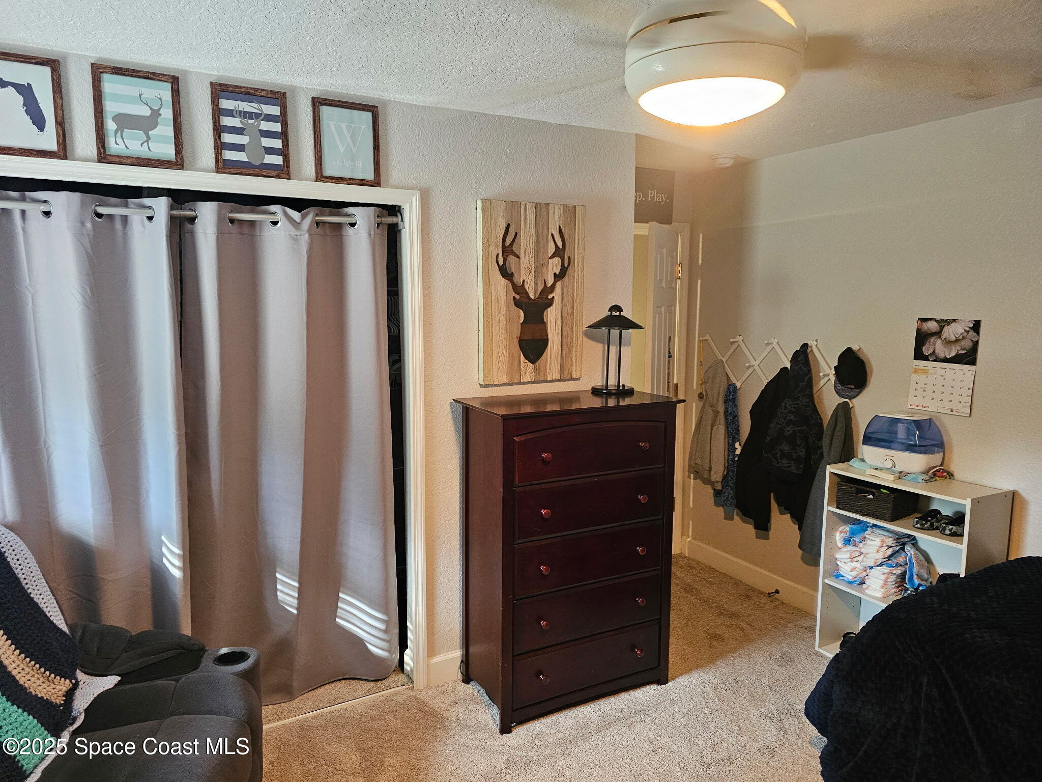 3094 Green Turtle Circle Mims, FL 32754 - Photo 39 of 63 a bedroom with a bed and a mirror