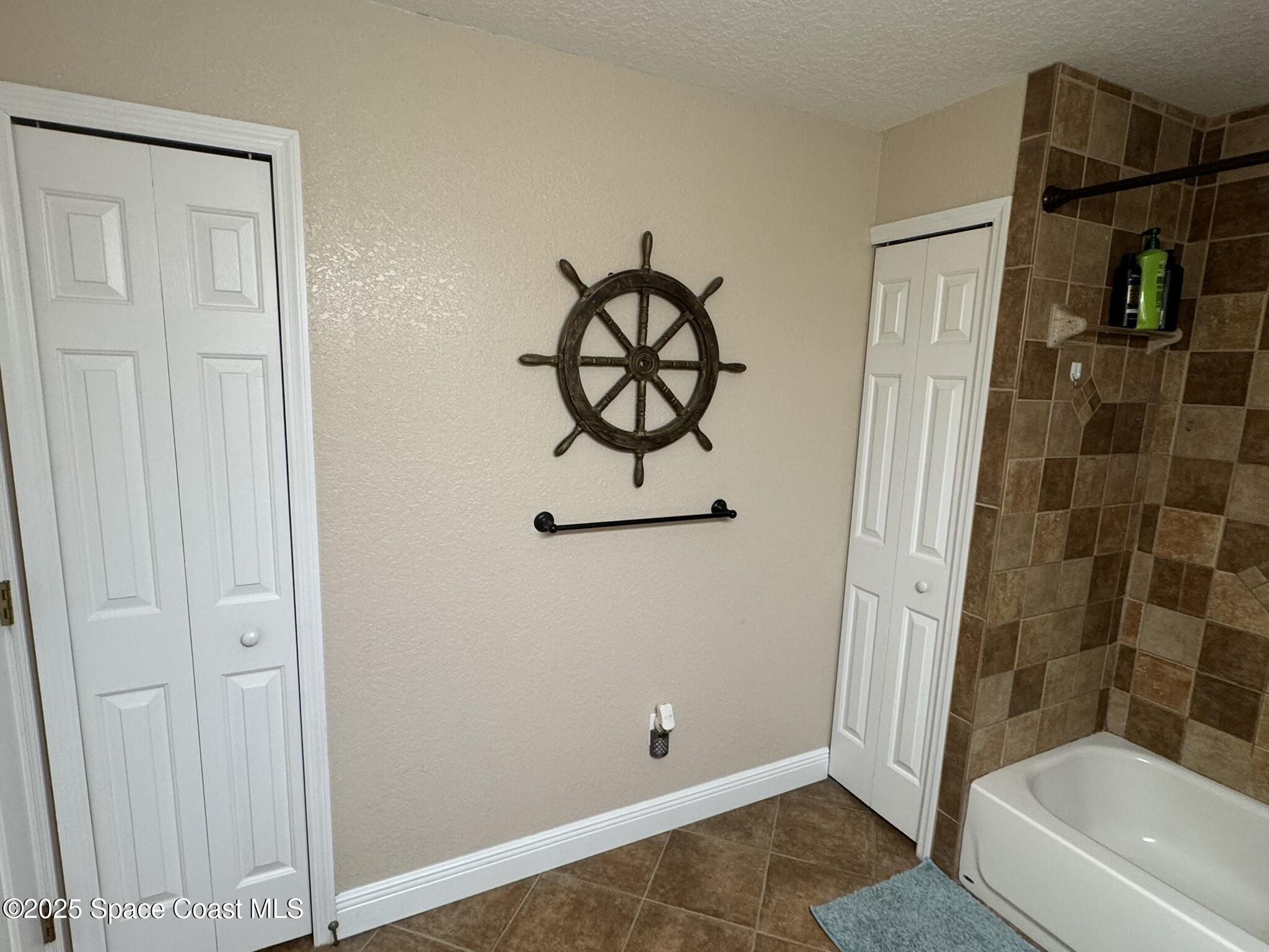 3094 Green Turtle Circle Mims, FL 32754 - Photo 43 of 63 a bathroom with a bathtub and a shower